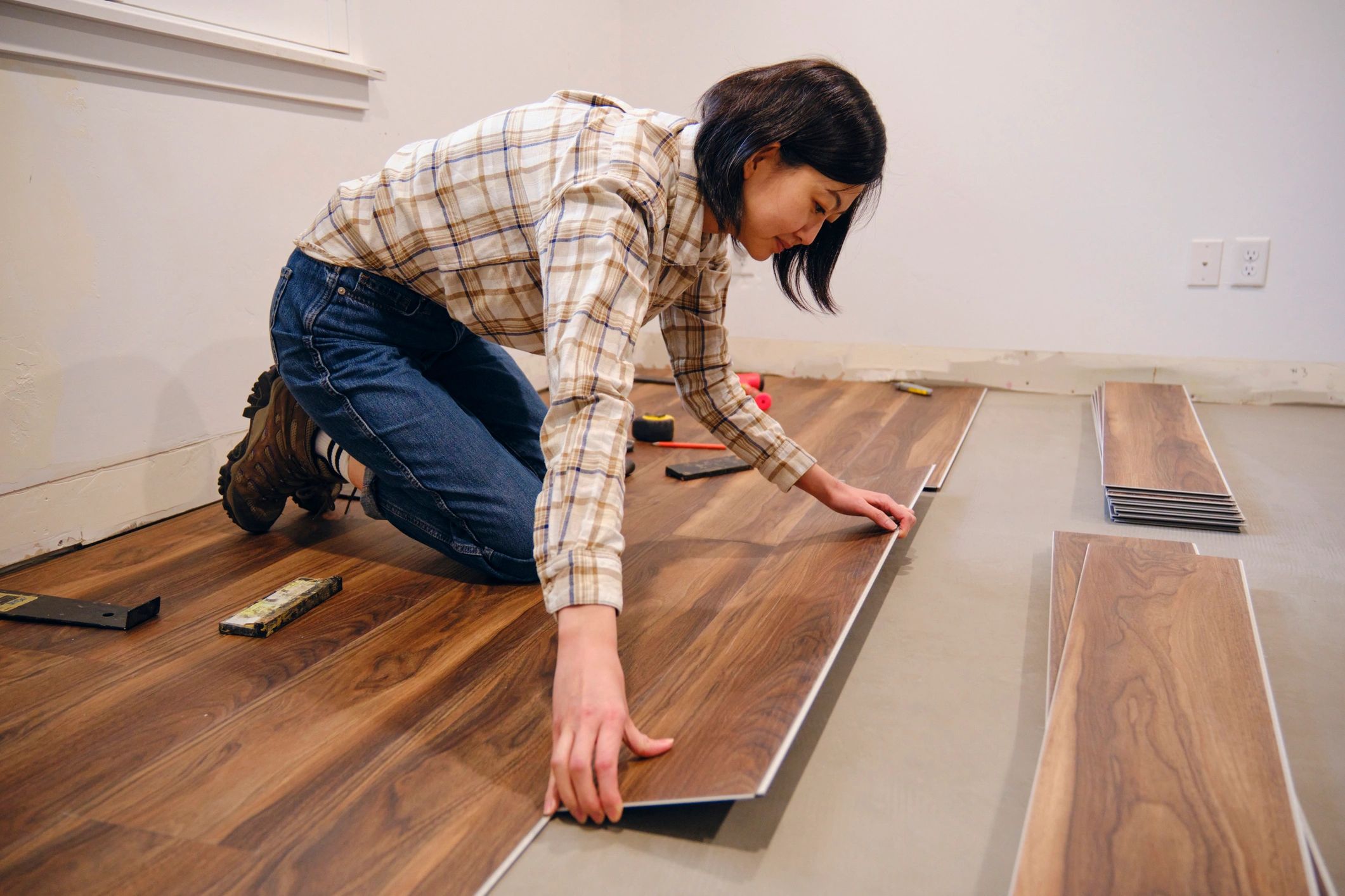 Happy homeowner in a renovated interior
